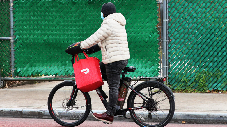 DoorDash delivery person on bike