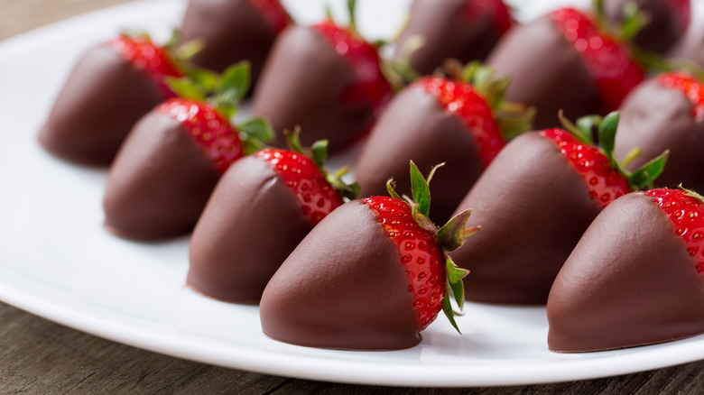 Chocolate covered strawberries on plate