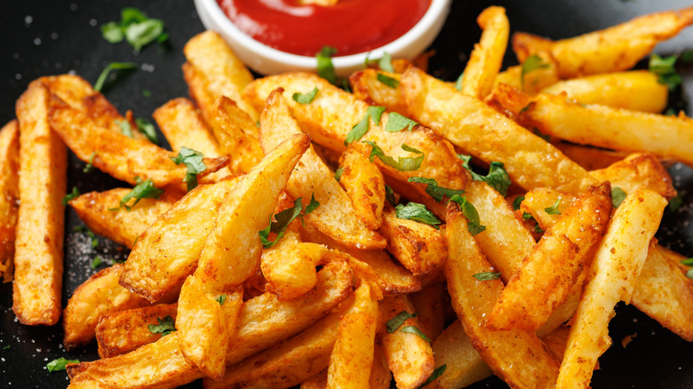 French fries on plate with ketchup