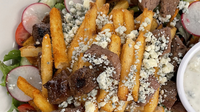 A close-up of the Metro Diner Pittsburgh steak salad from National French Fry Day in July of 2022.