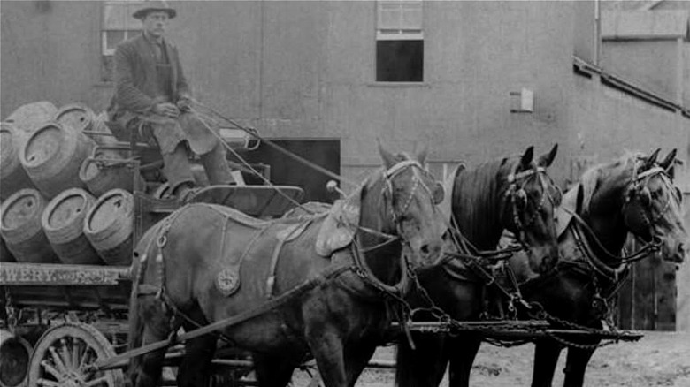 Black and white photograph of horse-drawn beer wagon