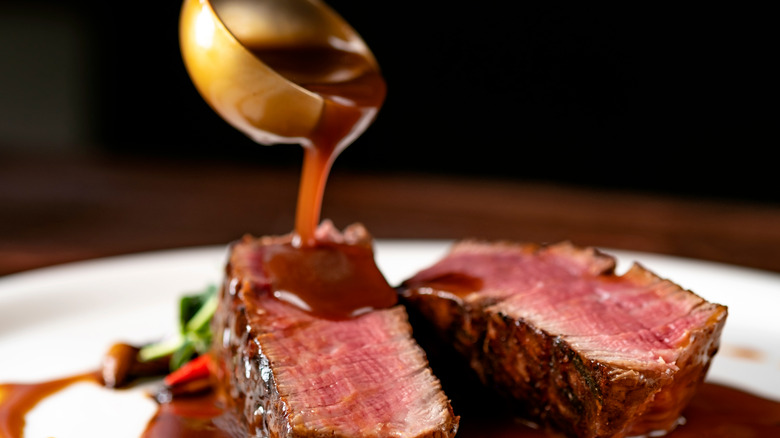 Beef au jus on a white plate