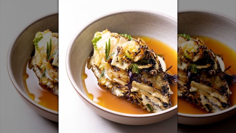 Wood-roasted cabbage with Alpinage raclette ham hock broth