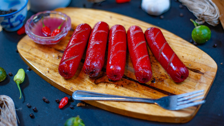 Filipino hot dogs on a wooden board