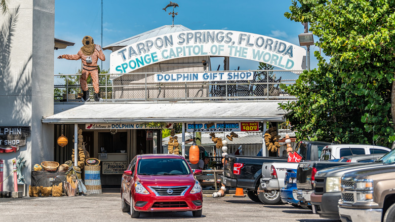 Tarpon Springs, Florida, sponge capital of the world signage in parking lot with cars