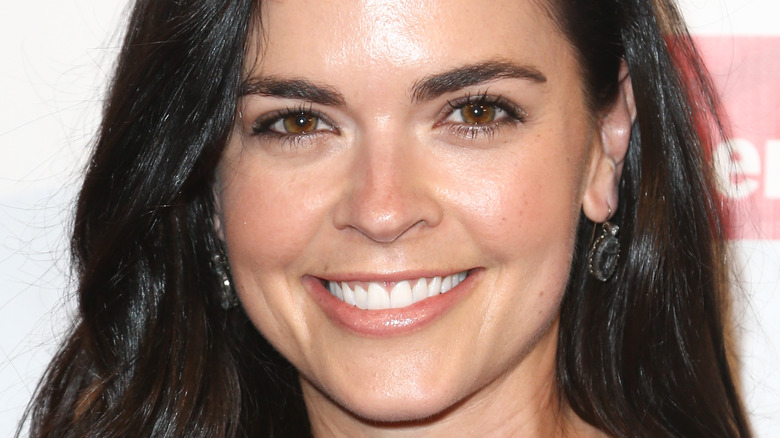 Katie Lee Biegel smiles with hair down