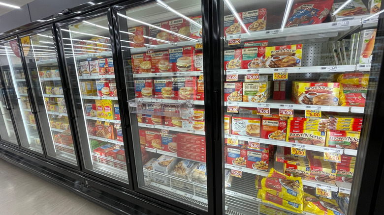 A grocery store fridge holding breakfast sandwiches.