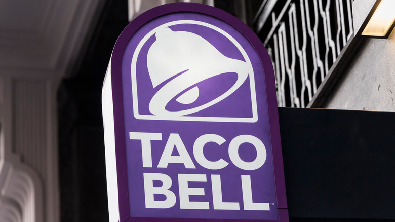 Taco Bell sign on outside of restaurant  