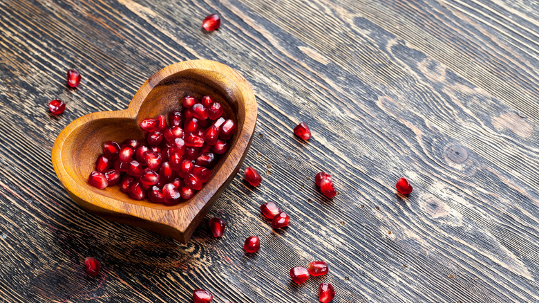 pomegranate seeds in heart-shaped bowl