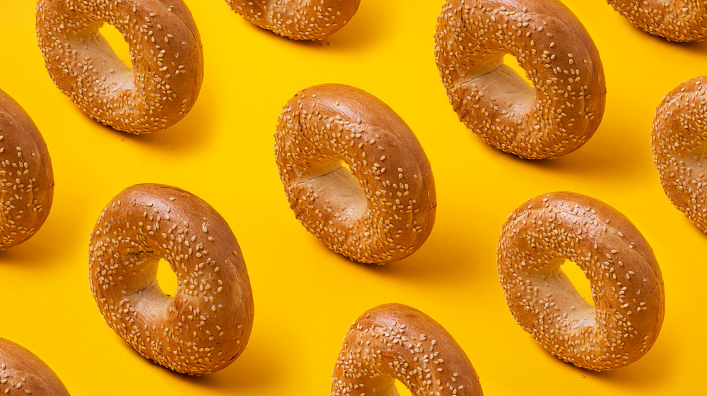 sesame bagels on yellow background