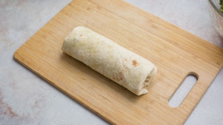 tortilla wrap on wooden board