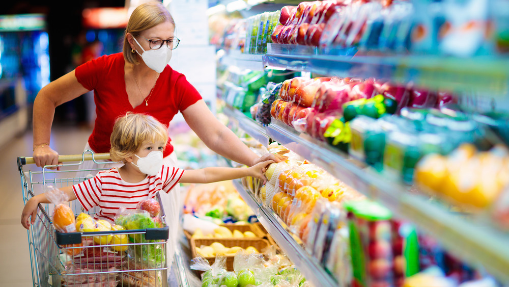 Woman and child grocery shopping