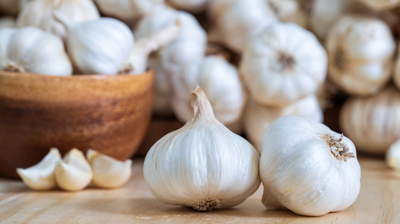 Garlic bulbs and cloves on wooden table