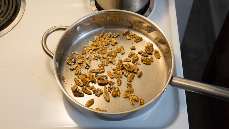 toasted walnuts in large pan