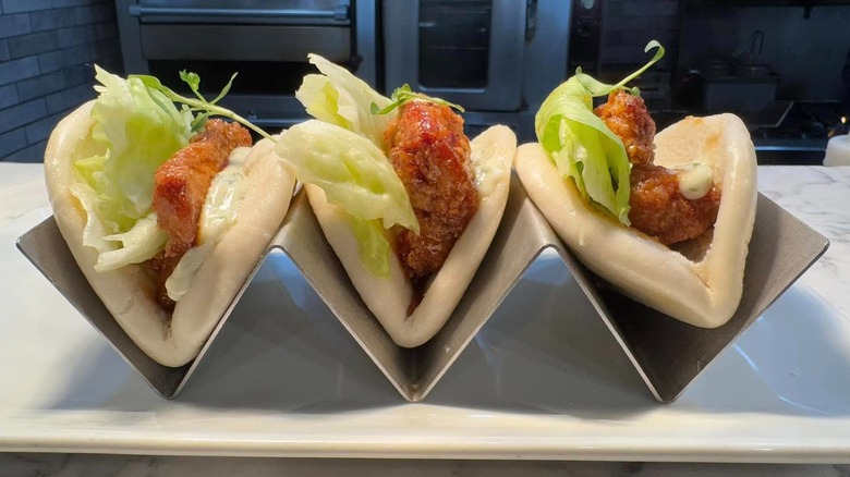 Chicken bao buns on metal tray in kitchen
