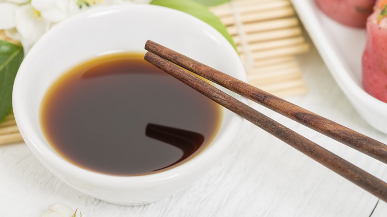 Bowl of hoisin sauce and chopsticks