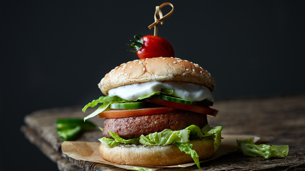 Impossible plant-based burger on dark table