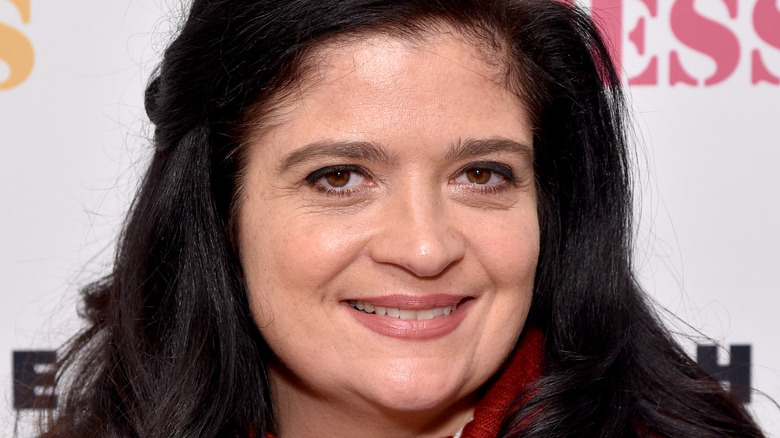 Alex Guarnaschelli smiling and posing at an event