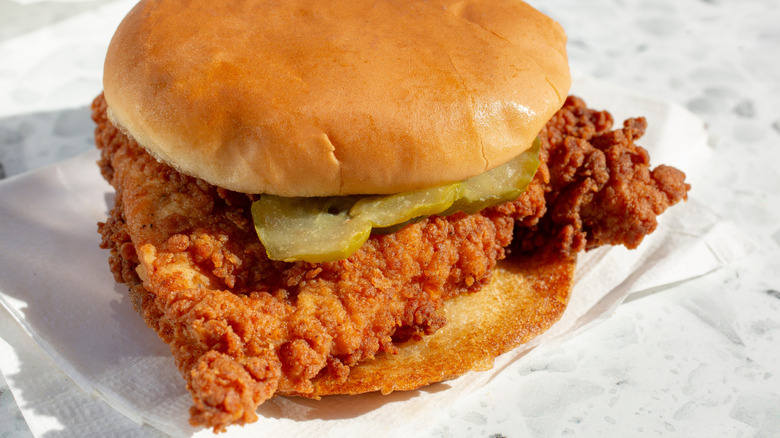 Fried chicken sandwich on white napkin