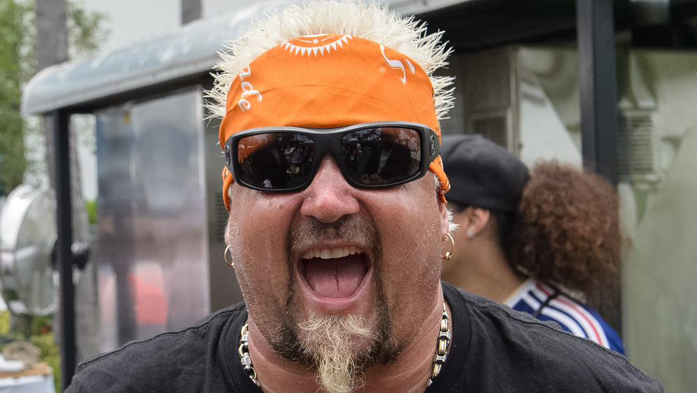 Guy Fieri with sunglasses and bandana