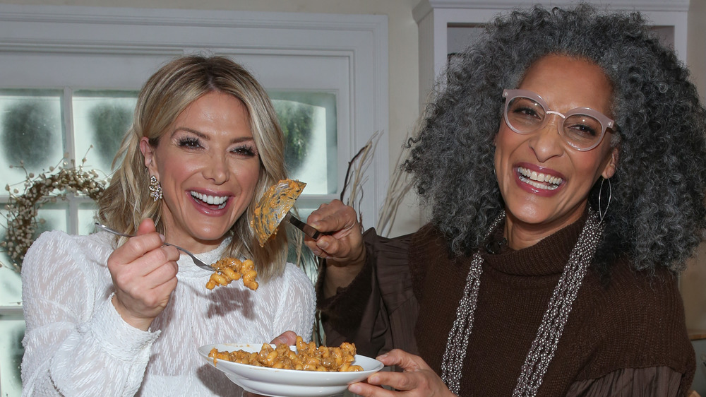 Chef Carla Hall sampling food