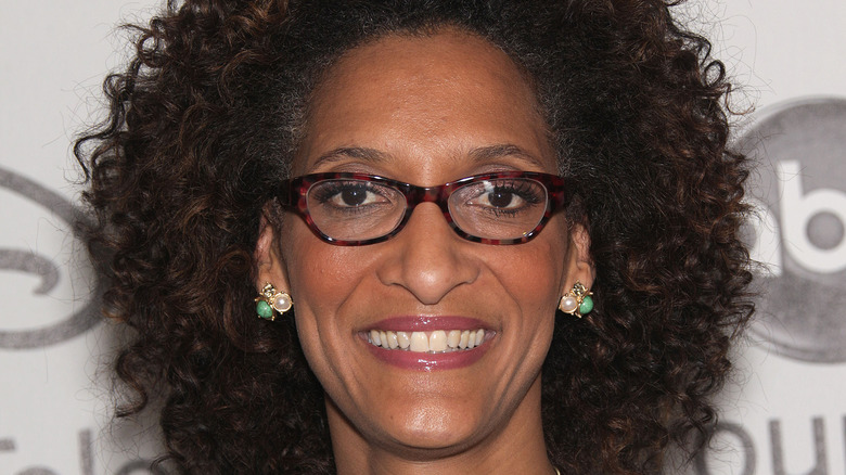 Carla Hall smiles in glasses