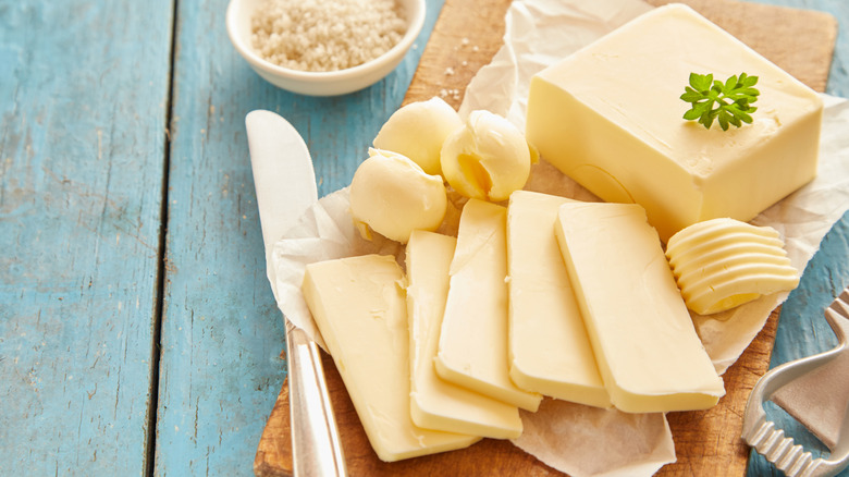 fresh butter on cutting board