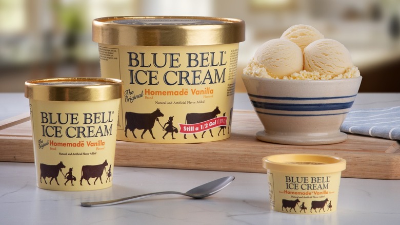 Bowl of Blue Bell Homemade Vanilla Ice Cream with cartons and spoon