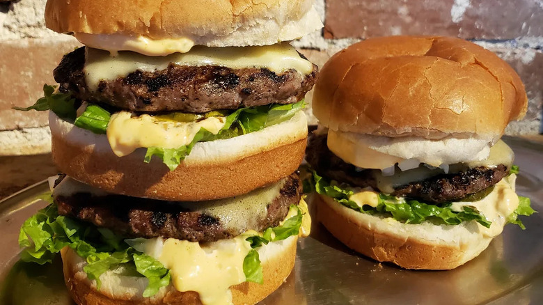 A trio of burgers on a platter