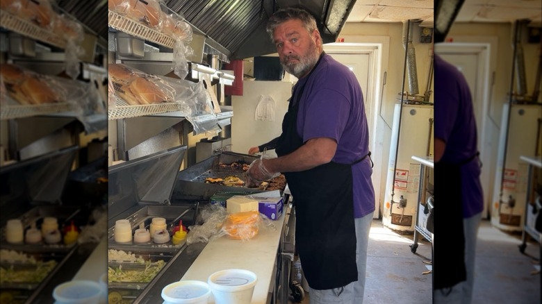 Smitty's Carry Out cook grilling burgers