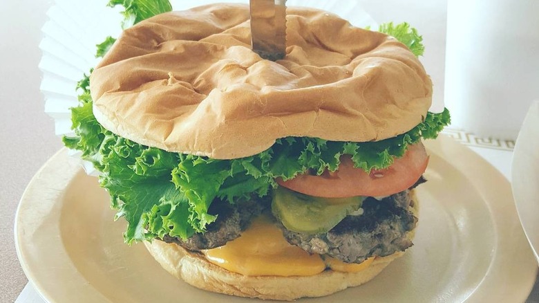 Big burger plated with knife
