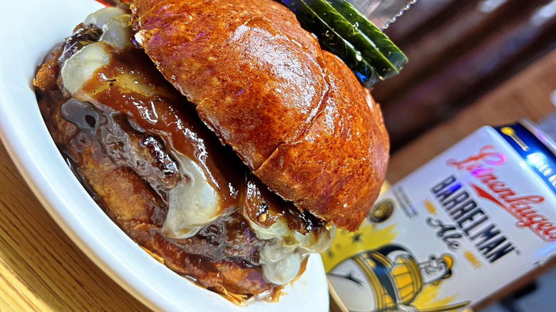Burger dripping with cheese and sauce