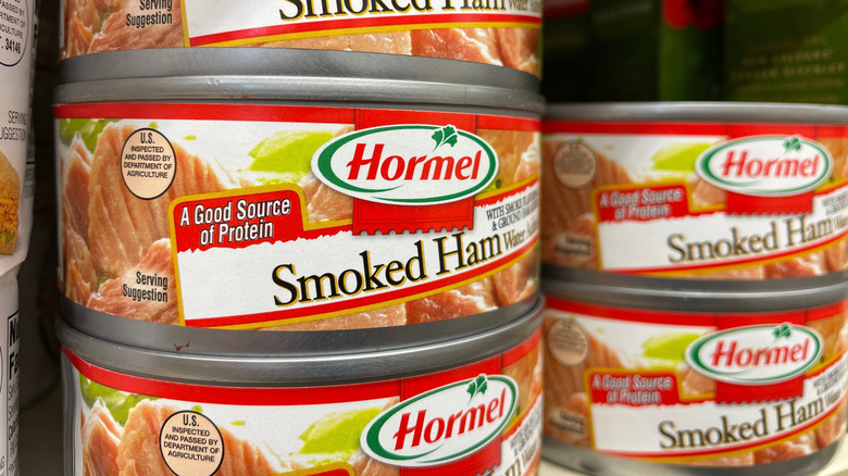 Stacked cans of Hormel smoked ham