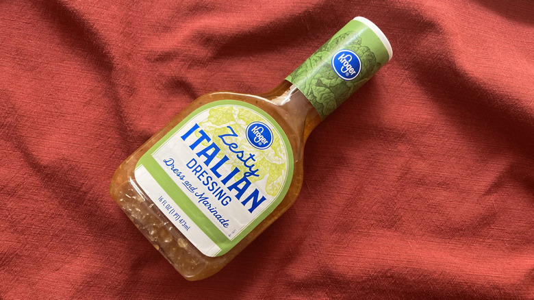 Bottle of Kroger zesty Italian dressing on red cloth
