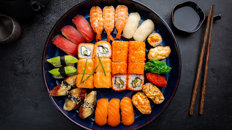 Various types of sushi placed on a plate
