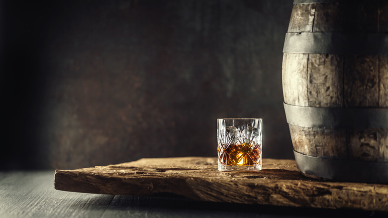 bourbon glass with a barrel