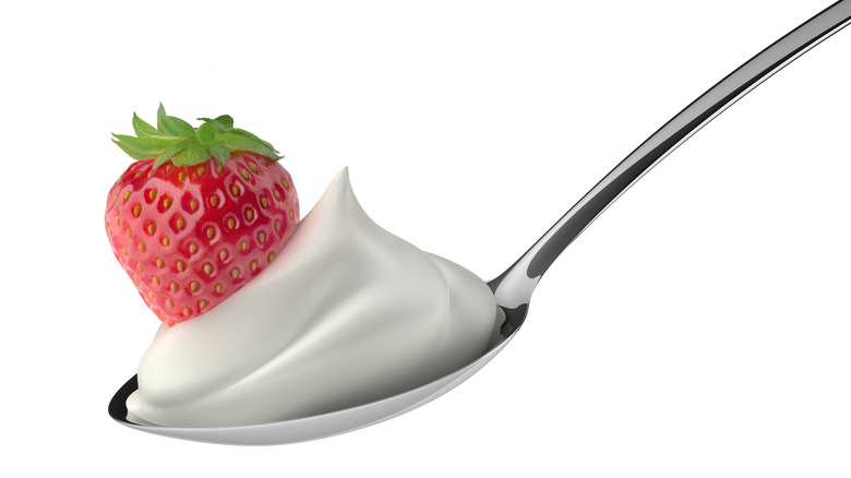 Spoonful of whip with strawberry