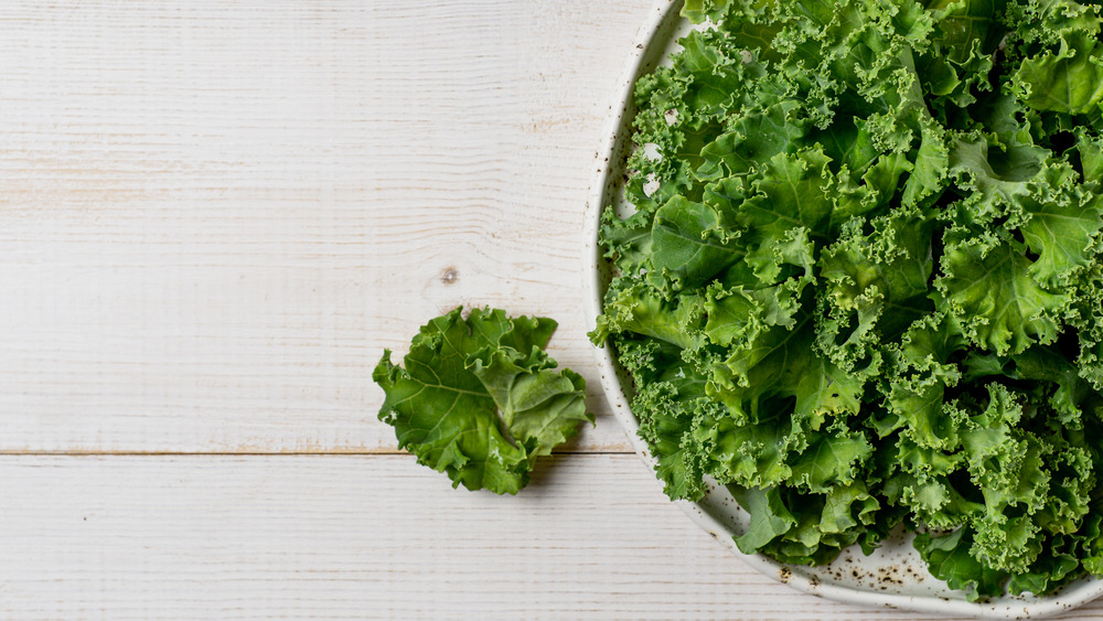 Kale on wood background