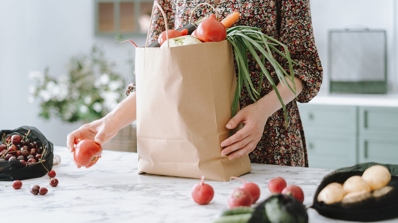 woman unloading grocery bag