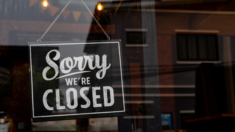"Closed" sign in shopfront window