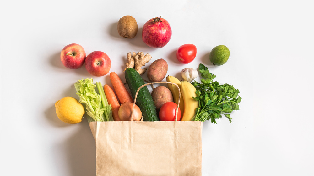 Groceries in a bag on a white background