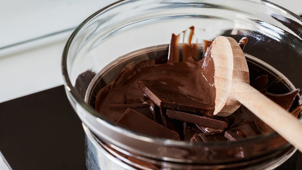 tempering chocolate over a double boiler wooden spoon