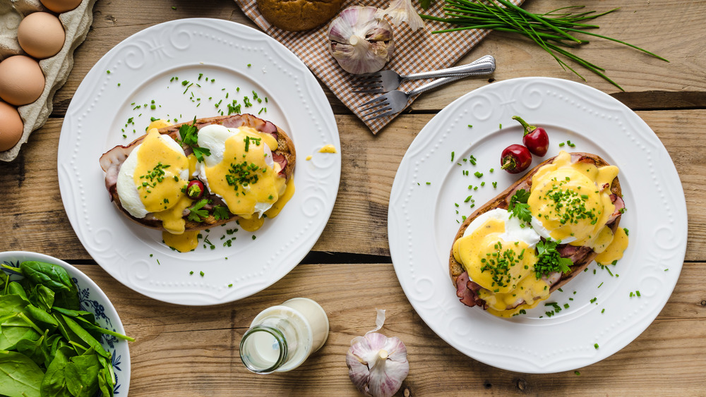 Plates of eggs Benedict