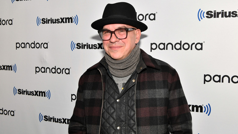 Michael Symon in black glasses