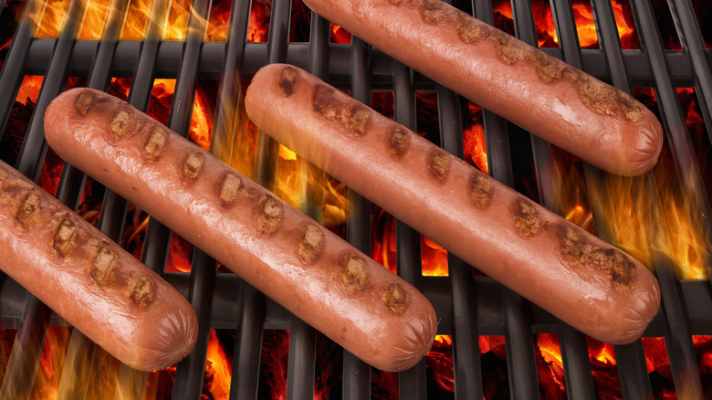 cooking hot dogs on the grill
