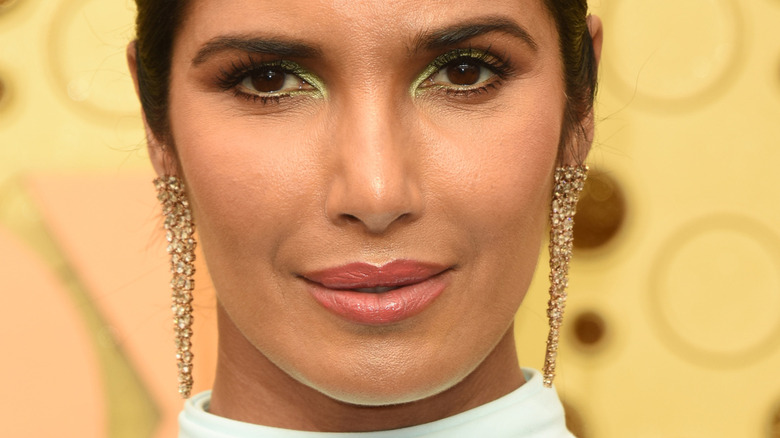 Padma Lakshmi wearing diamond earrings