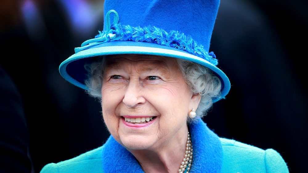 Queen Elizabeth II in blue hat