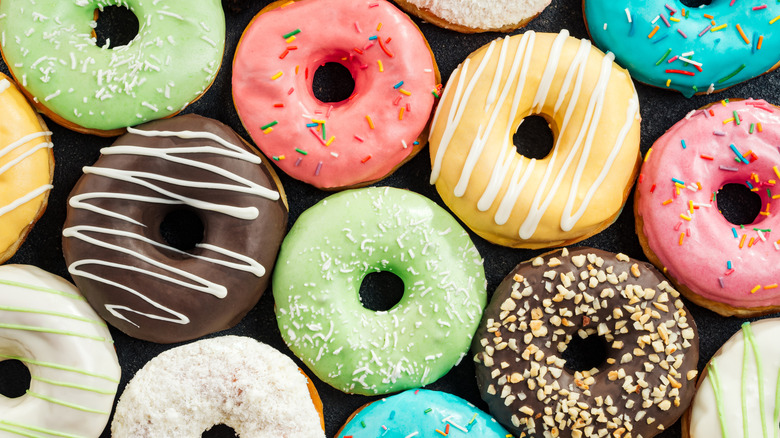 A batch of colorfully frosted donuts