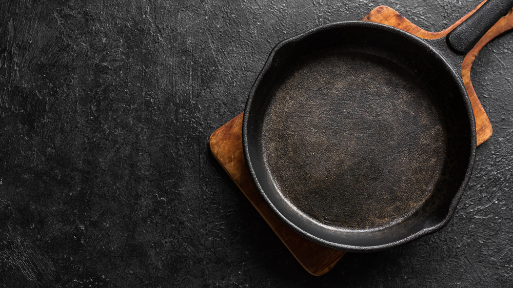 Cast iron skillet on wooden board