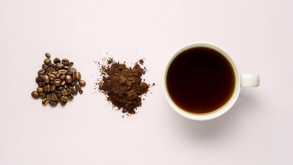 coffee beans, instant coffee crystals, cup of coffee white background